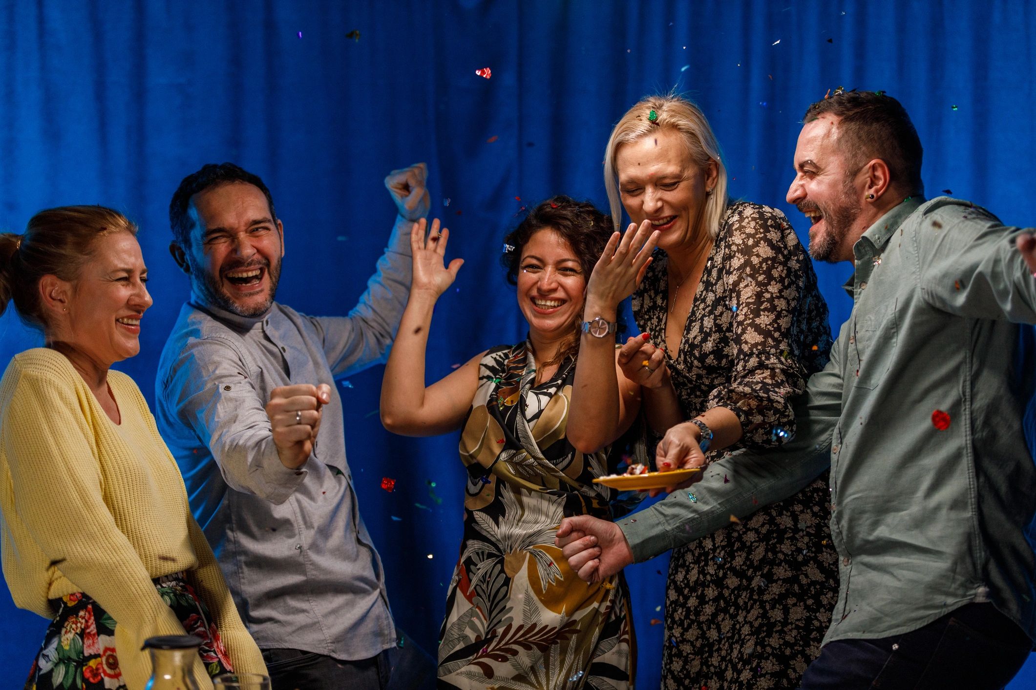 Friends celebrating with confetti at a party